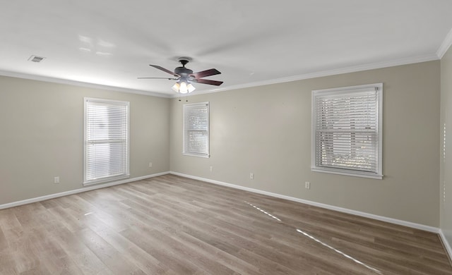 empty room with light wood-type flooring, ceiling fan, and crown molding