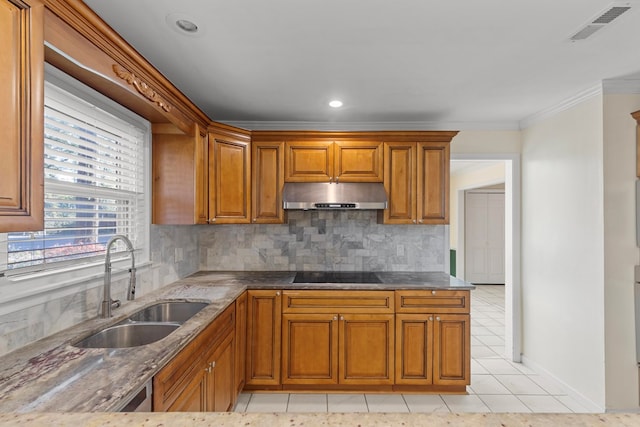 kitchen featuring black electric stovetop, backsplash, ornamental molding, sink, and light tile patterned flooring