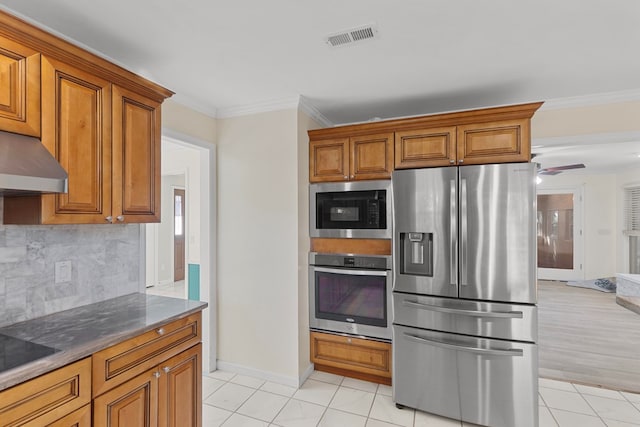 kitchen with decorative backsplash, light tile patterned flooring, ornamental molding, and appliances with stainless steel finishes