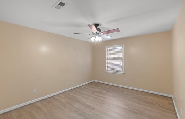 empty room featuring ceiling fan and light wood-type flooring