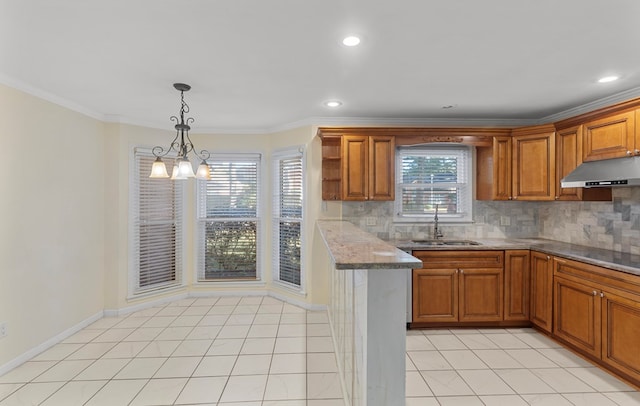 kitchen featuring an inviting chandelier, crown molding, sink, light tile patterned floors, and light stone counters