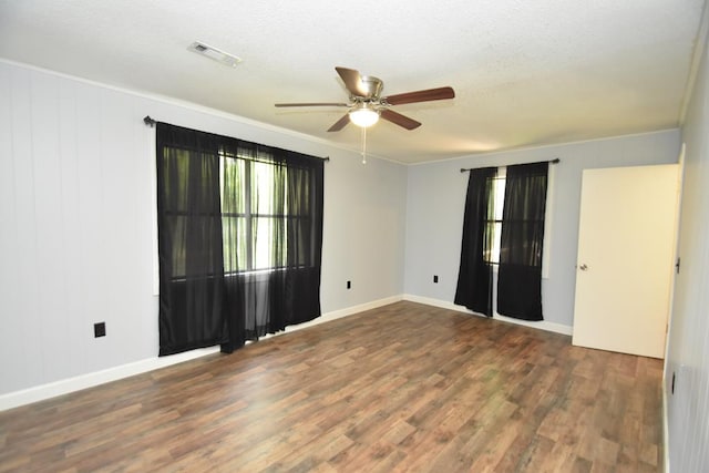 145 Deerpath St, Ozark, AL 36360 - unfurnished room featuring a ceiling fan, wood finished floors, baseboards, a textured ceiling, and crown molding