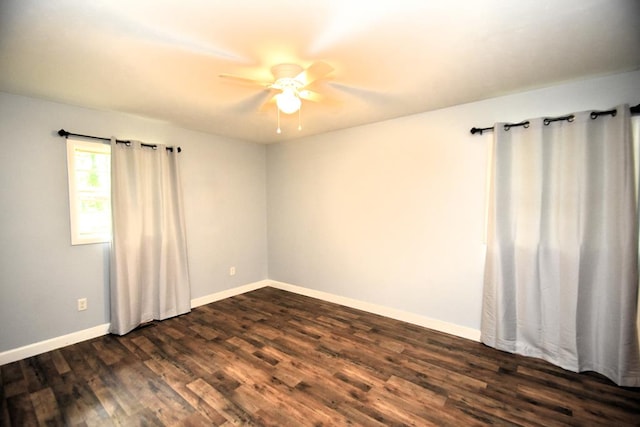 145 Deerpath St, Ozark, AL 36360 - spare room with a ceiling fan, dark wood-style floors, and baseboards