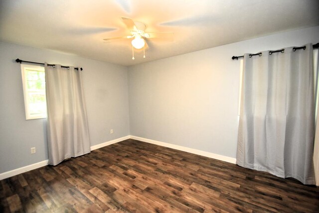 145 Deerpath St, Ozark, AL 36360 - empty room with dark wood-type flooring, ceiling fan, and baseboards