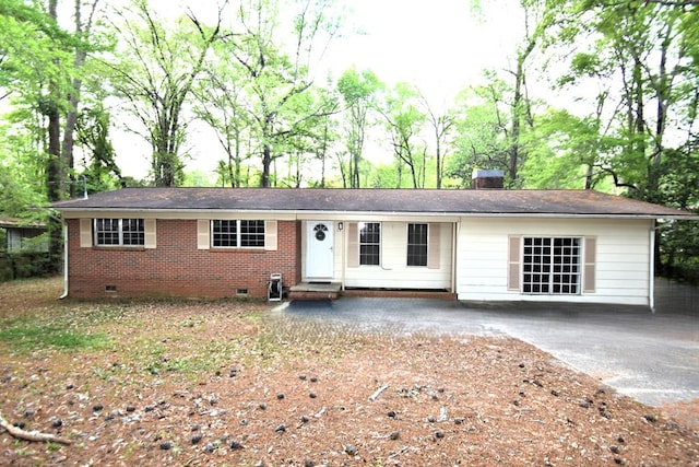 ranch-style home with brick siding, entry steps, crawl space, and a chimney
