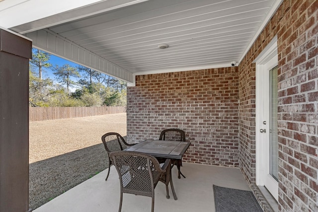 view of patio featuring fence