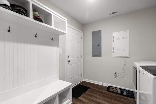 mudroom with dark wood-type flooring, independent washer and dryer, and electric panel