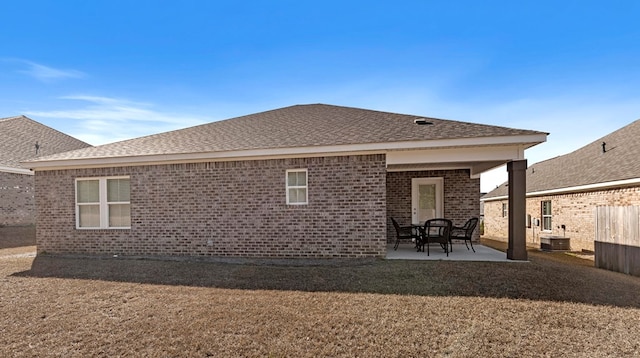 back of house with a patio area and central AC