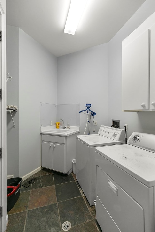 109 Royal Highlands Ln, Dothan, AL 36305 - washroom featuring cabinet space, washer and dryer, and stone tile flooring
