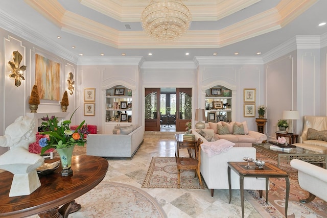 109 Royal Highlands Ln, Dothan, AL 36305 - living room featuring a chandelier, crown molding, a towering ceiling, and a decorative wall