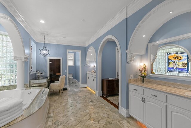 109 Royal Highlands Ln, Dothan, AL 36305 - bathroom featuring stone tile flooring, a whirlpool tub, plenty of natural light, vanity, and recessed lighting