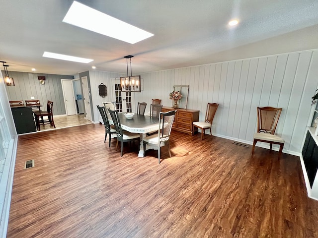 601 6th Ave, Ashford, AL 36312 - dining area with wood finished floors, a chandelier, and a skylight