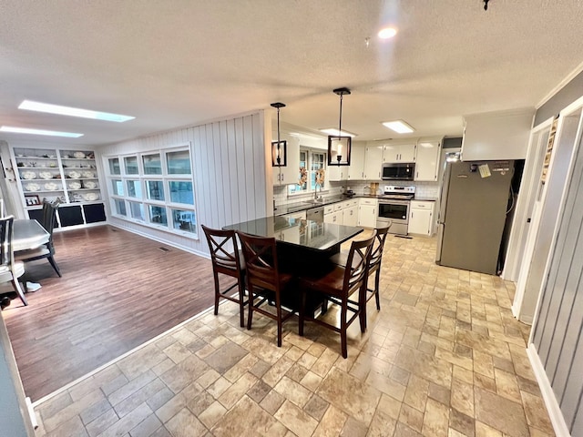 601 6th Ave, Ashford, AL 36312 - dining room featuring a textured ceiling, built in features, and a skylight