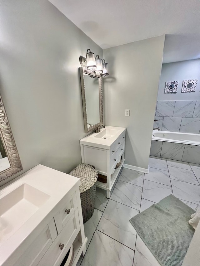 601 6th Ave, Ashford, AL 36312 - full bath with marble look tiles, vanity, and a relaxing tiled tub