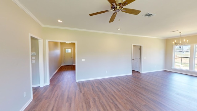 spare room featuring ceiling fan with notable chandelier, crown molding, and dark wood-type flooring