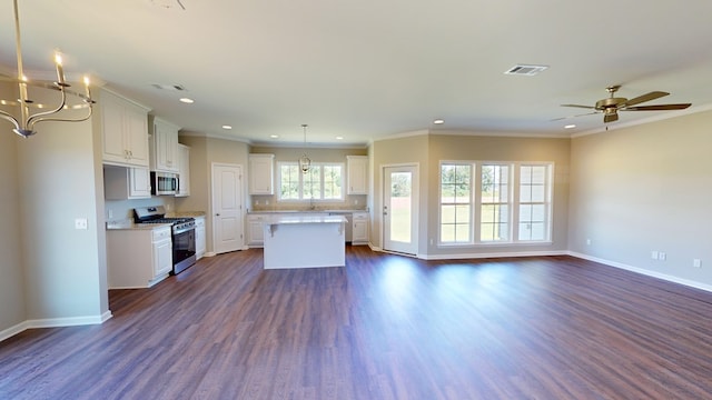 kitchen featuring a kitchen island, dark hardwood / wood-style flooring, white cabinetry, and stainless steel appliances