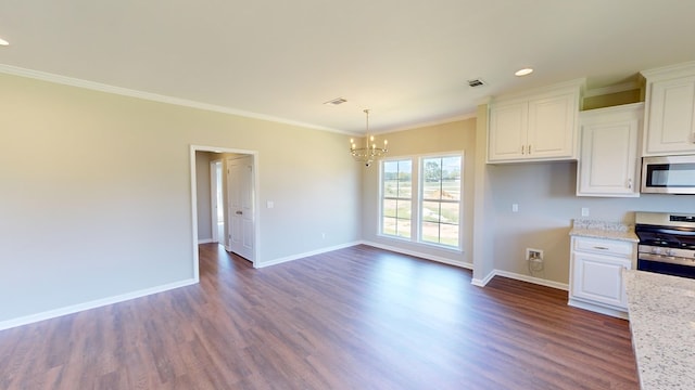 kitchen featuring light stone counters, dark hardwood / wood-style flooring, white cabinetry, and stainless steel appliances