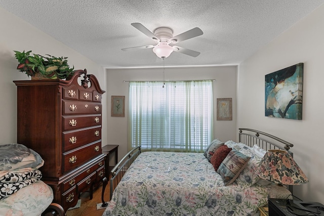 303 Denise St, Dothan, AL 36305 - bedroom featuring wood finished floors, a textured ceiling, and a ceiling fan