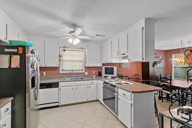 303 Denise St, Dothan, AL 36305 - kitchen featuring stainless steel refrigerator with ice dispenser, white dishwasher, range with electric cooktop, a sink, and under cabinet range hood