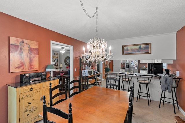 303 Denise St, Dothan, AL 36305 - dining space featuring light tile patterned floors, a chandelier, ceiling fan, and a textured ceiling