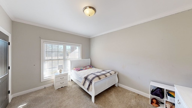 carpeted bedroom featuring ornamental molding