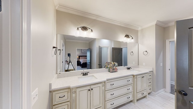 bathroom with vanity and ornamental molding