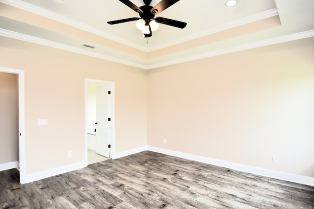 5120 Judge Logue Rd, Newton, AL 36352 - spare room with dark wood-type flooring, a raised ceiling, a ceiling fan, ornamental molding, and recessed lighting