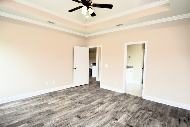 5120 Judge Logue Rd, Newton, AL 36352 - unfurnished bedroom featuring wood finished floors, a raised ceiling, crown molding, and ensuite bathroom