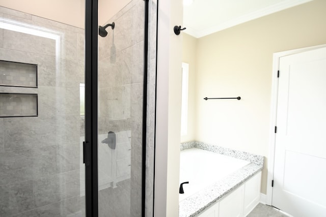 5120 Judge Logue Rd, Newton, AL 36352 - bathroom featuring a stall shower, a garden tub, and ornamental molding