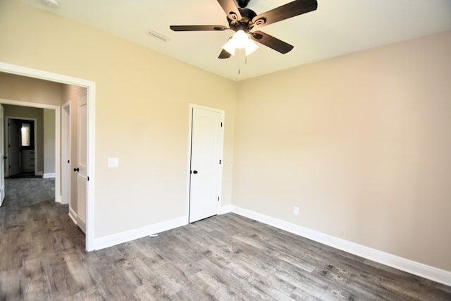 5120 Judge Logue Rd, Newton, AL 36352 - unfurnished bedroom featuring dark wood-style floors and a ceiling fan
