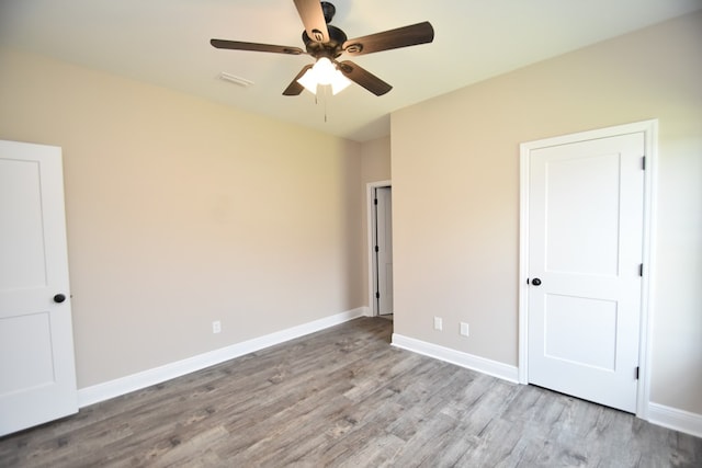 5120 Judge Logue Rd, Newton, AL 36352 - unfurnished bedroom featuring wood finished floors and a ceiling fan