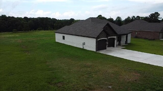 5120 Judge Logue Rd, Newton, AL 36352 - view of front of property featuring a front yard, driveway, a garage, and a shingled roof