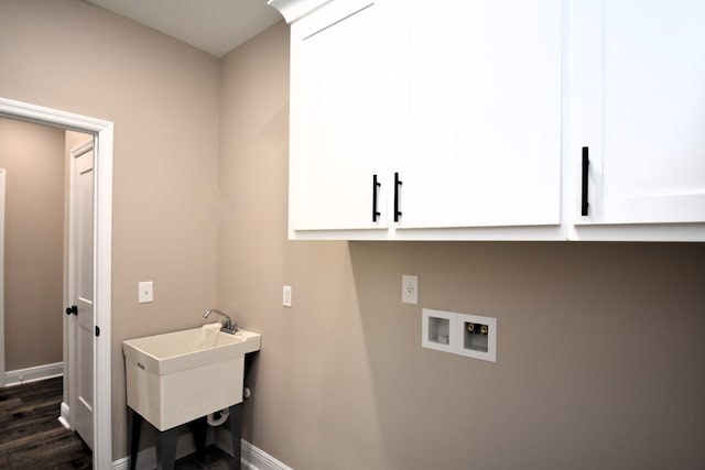 5120 Judge Logue Rd, Newton, AL 36352 - laundry room featuring cabinet space, hookup for a washing machine, and dark wood finished floors
