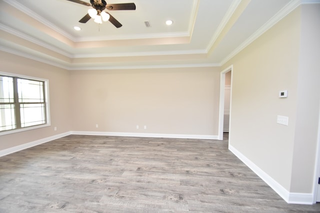 5120 Judge Logue Rd, Newton, AL 36352 - unfurnished room featuring a tray ceiling, ceiling fan, wood finished floors, crown molding, and recessed lighting