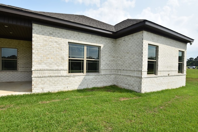 5120 Judge Logue Rd, Newton, AL 36352 - view of property exterior with brick siding and a lawn