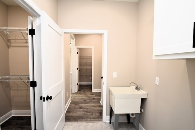 5120 Judge Logue Rd, Newton, AL 36352 - bathroom with a walk in closet and wood finished floors