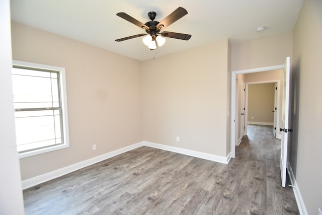 5120 Judge Logue Rd, Newton, AL 36352 - empty room featuring wood finished floors, ceiling fan, and a smoke detector