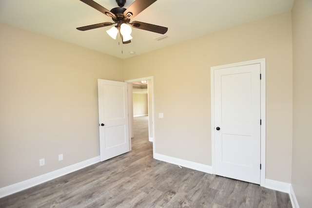 5120 Judge Logue Rd, Newton, AL 36352 - unfurnished bedroom featuring wood finished floors and ceiling fan
