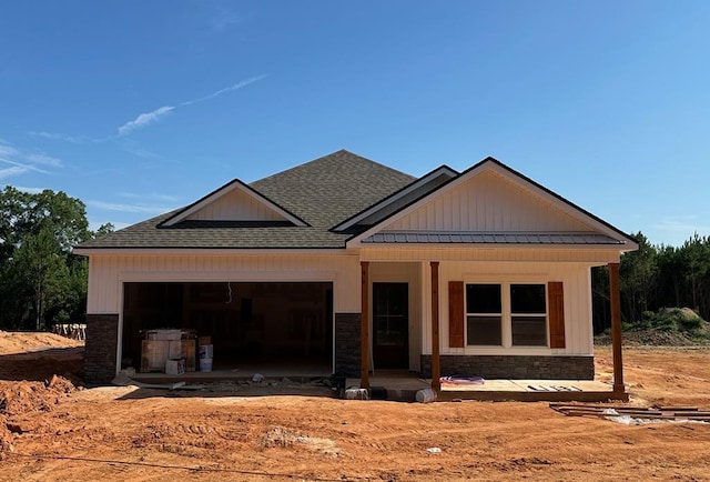 105 Jeter Dr, Midland City, AL 36350 - view of front facade with an attached garage, a shingled roof, and a standing seam roof