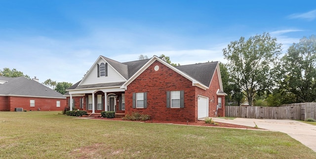 front of property featuring a front lawn, a porch, and a garage