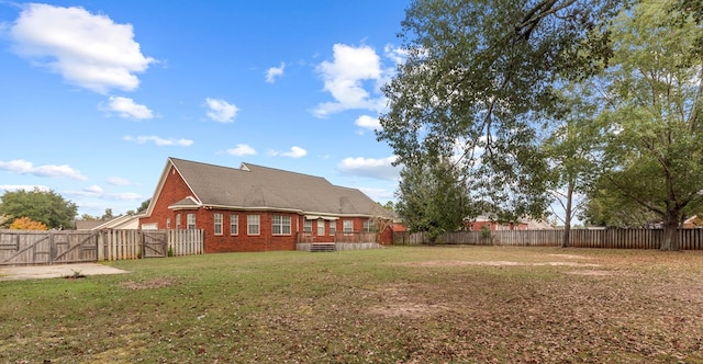 back of property with a lawn