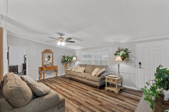 living room featuring hardwood / wood-style flooring, vaulted ceiling, ceiling fan, and crown molding