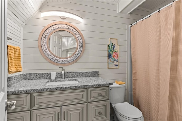 full bathroom with toilet, a shower with curtain, wood walls, and vanity