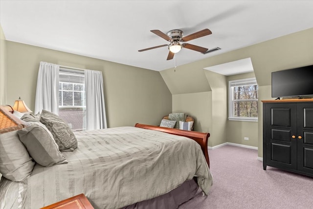 carpeted bedroom featuring visible vents, vaulted ceiling, baseboards, and ceiling fan