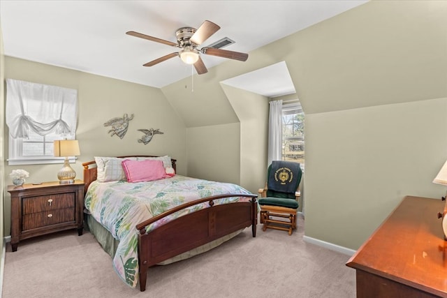 carpeted bedroom with vaulted ceiling, visible vents, a ceiling fan, and baseboards