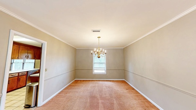 spare room with visible vents, baseboards, a notable chandelier, ornamental molding, and light carpet
