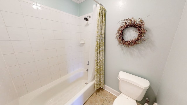 full bathroom featuring tile patterned floors, toilet, and shower / tub combo