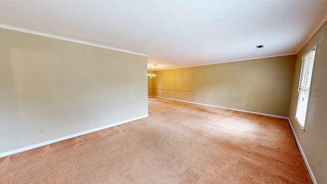 unfurnished room with crown molding, baseboards, a chandelier, and carpet