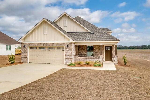 view of front facade featuring a yard and a garage