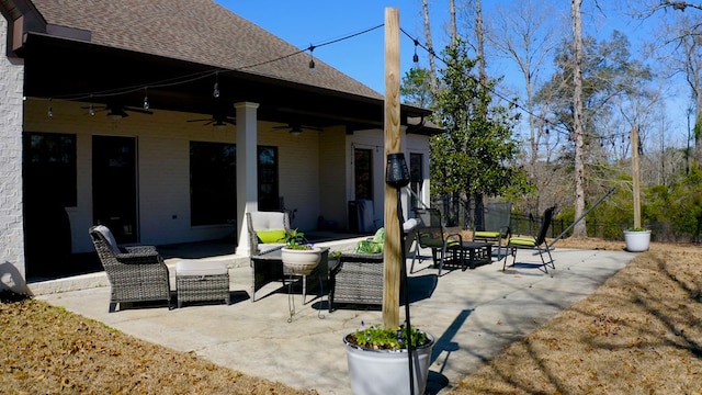 view of patio with outdoor lounge area and ceiling fan